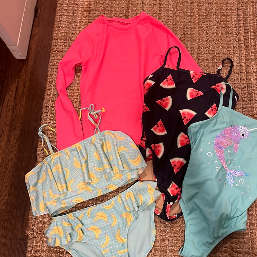 Girls 10/12 assortment of swimsuits and swimsuit long sleeve swim top. Excellent